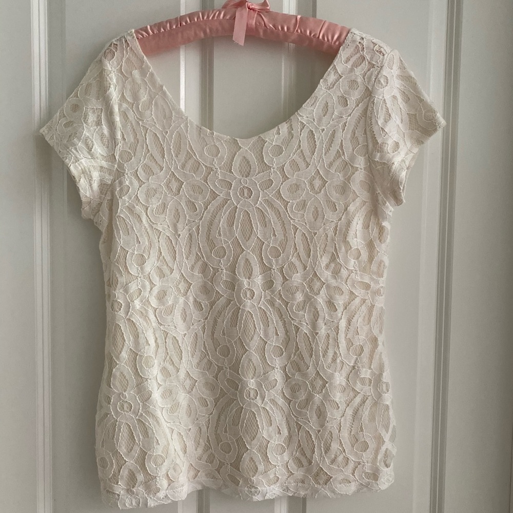 Ivory-toned, short sleeved dressy lace tee